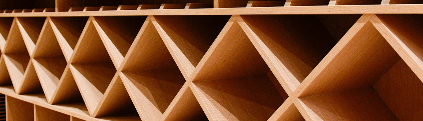 Close-up of a wooden shelf with geometric design