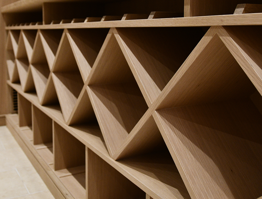 Close-up of a wooden shelf with geometric design