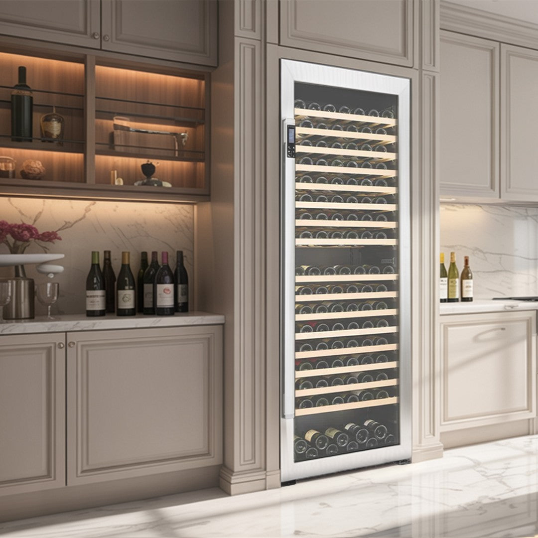 Modern kitchen with a wine cooler and wine bottles.