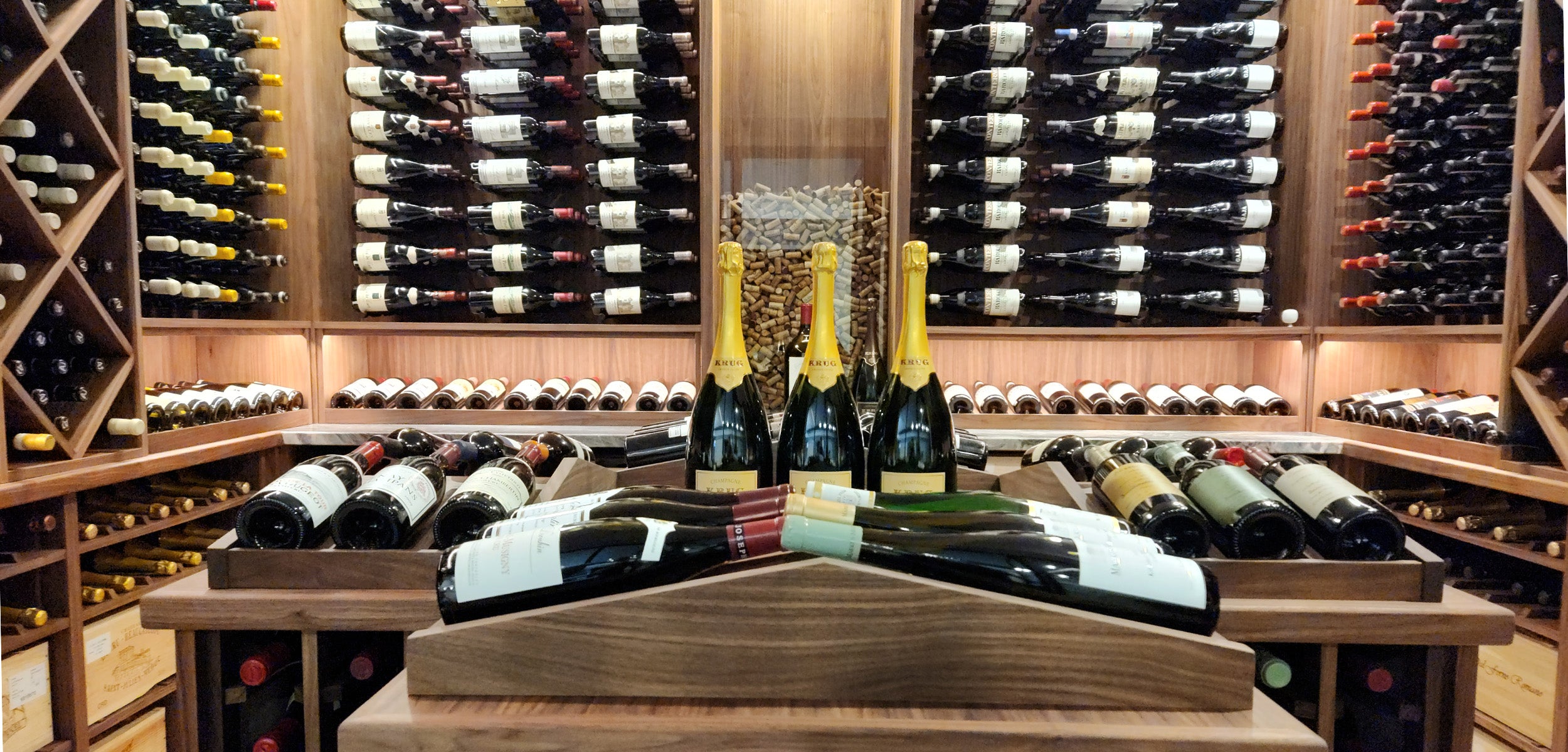 Wooden wine rack with wine bottles and wine stoppers