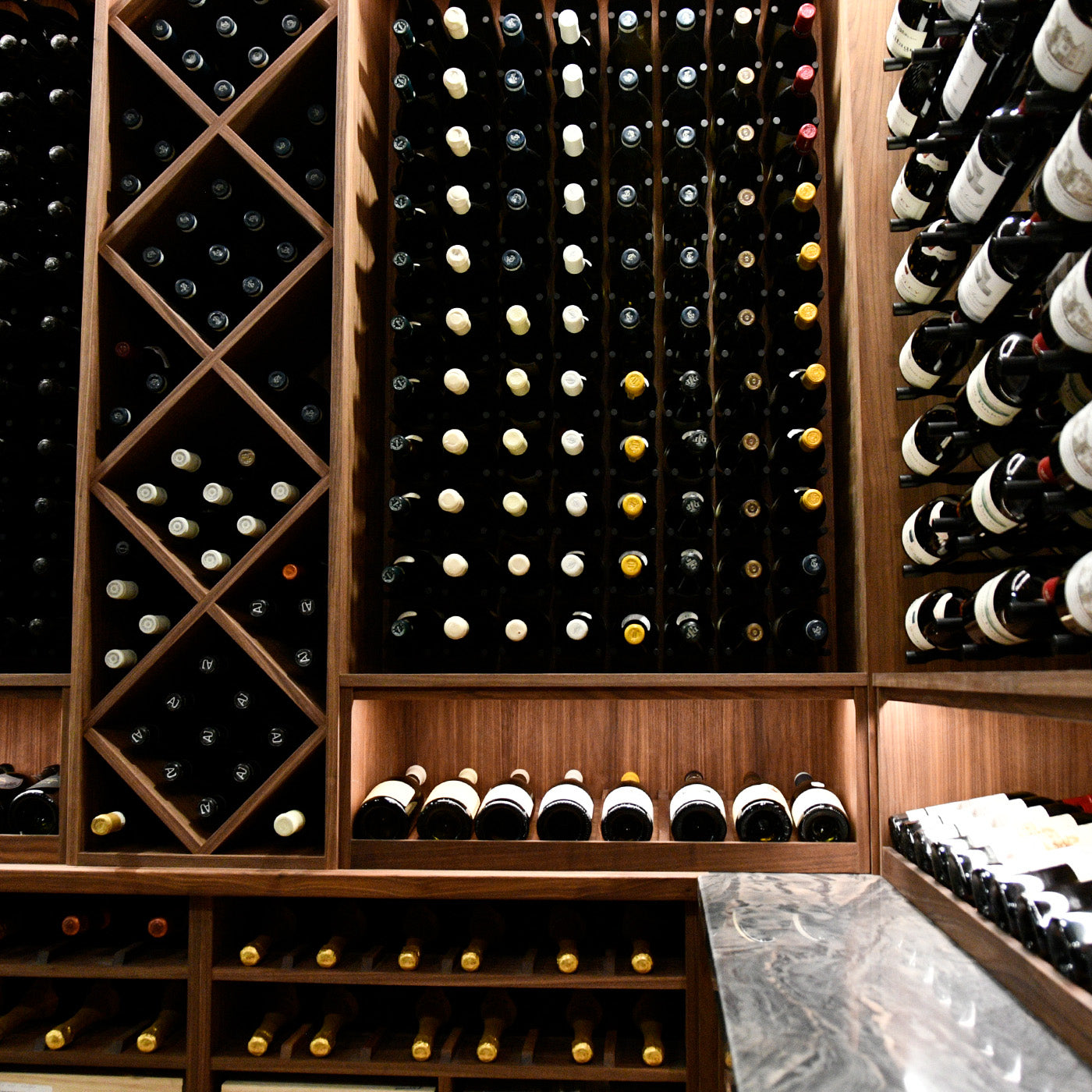 Wooden rack with wine bottles arranged on shelves