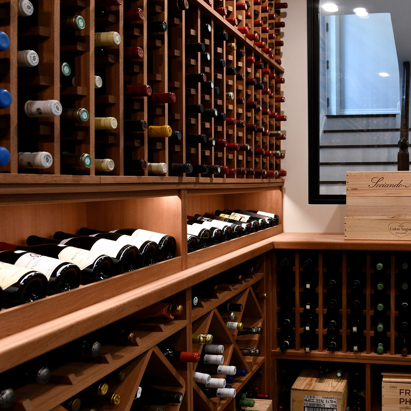 Wooden wine rack with wine bottles