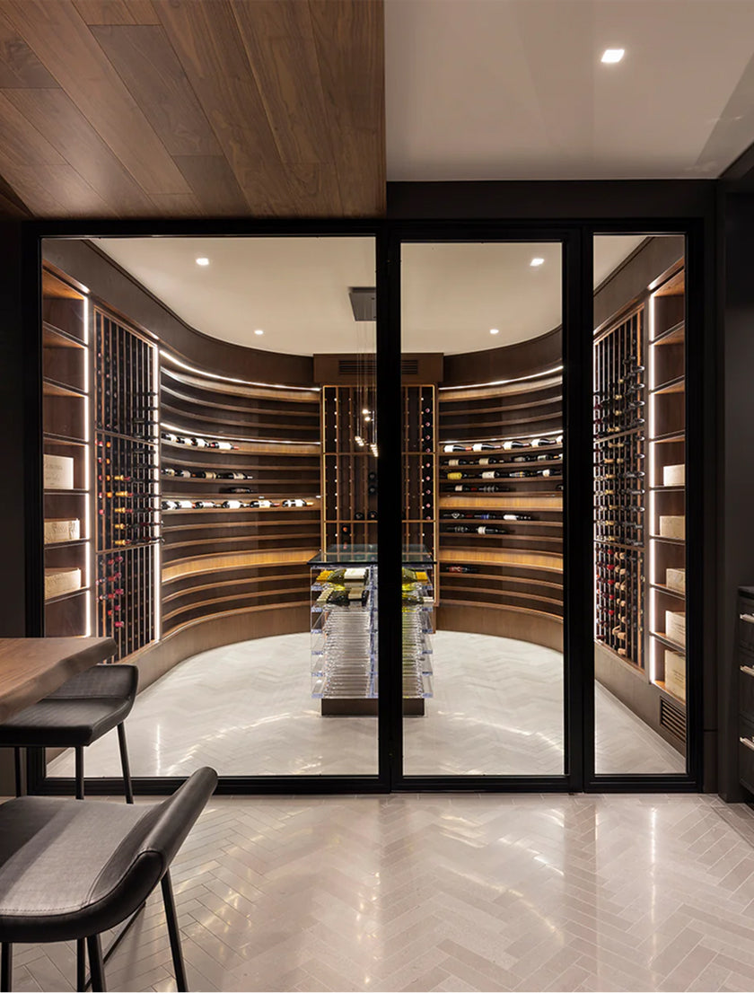 laxury room filled with multiple wine rack shelves holding wine bottles and wine galss.
