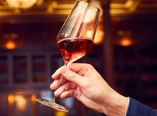 Wine glass holding on hand