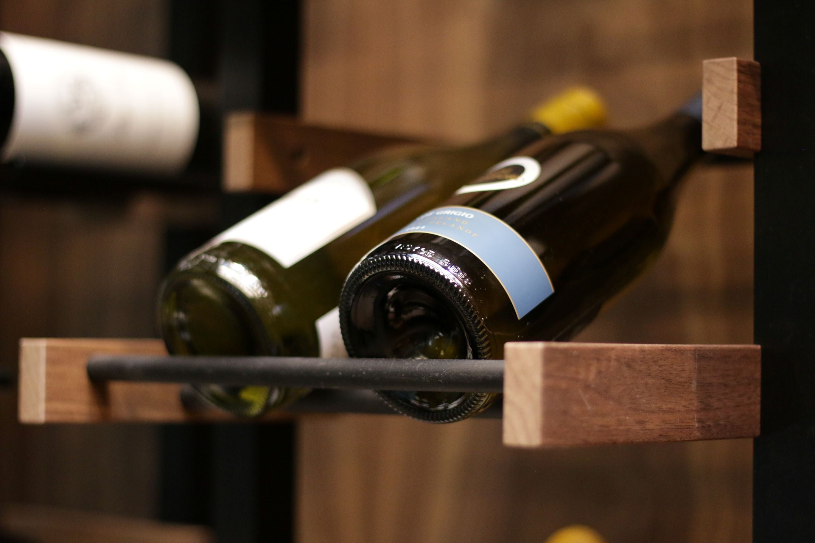 Wine bottles arranged on Premier CRU wooden rack.