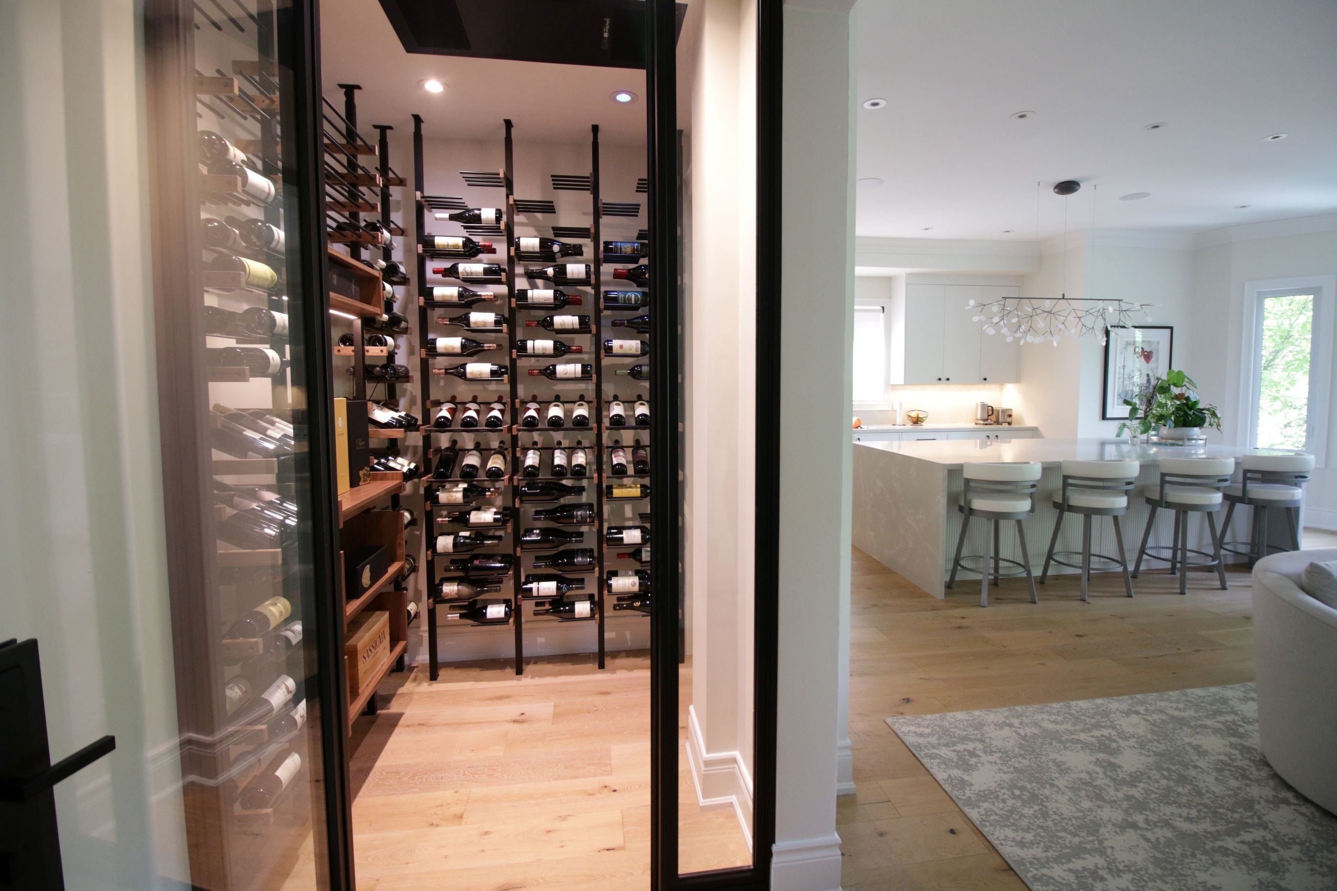 Wine bottles arranged on a Premier CRU bottles, leading to a living room area.