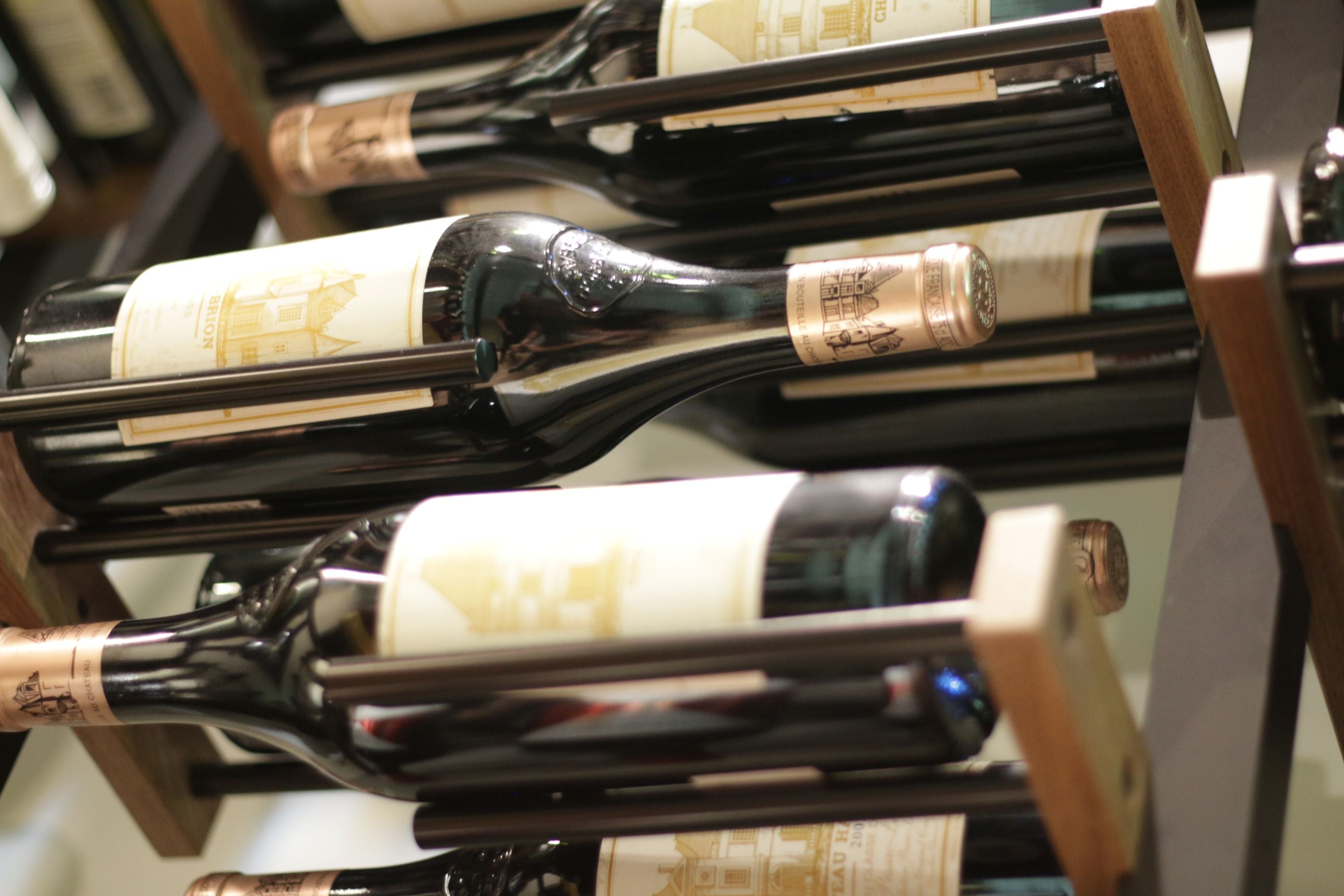 Wine bottles arranged on Premier CRU wooden rack.