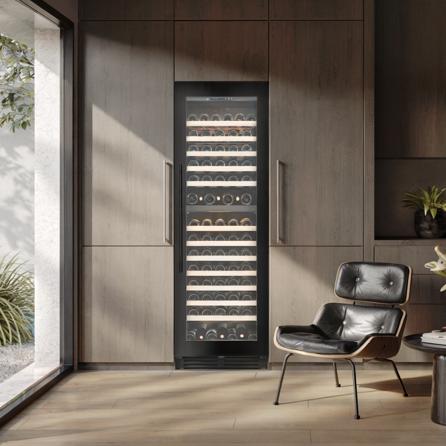 Modern wine cooler in a stylish interior setting with a chair and plants.