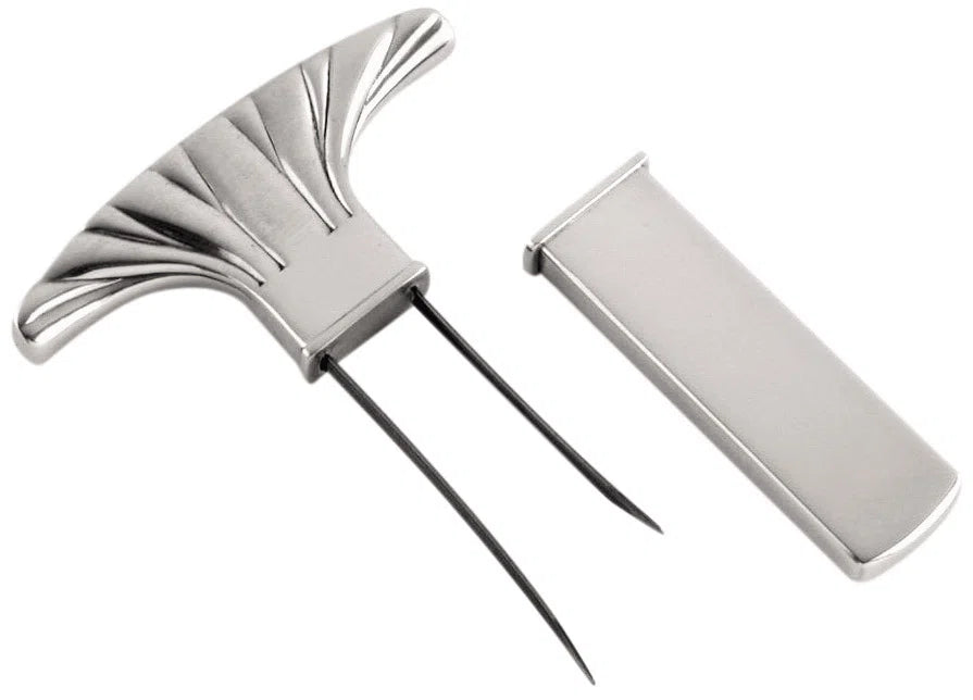Metallic hair clip with a decorative design on a white background